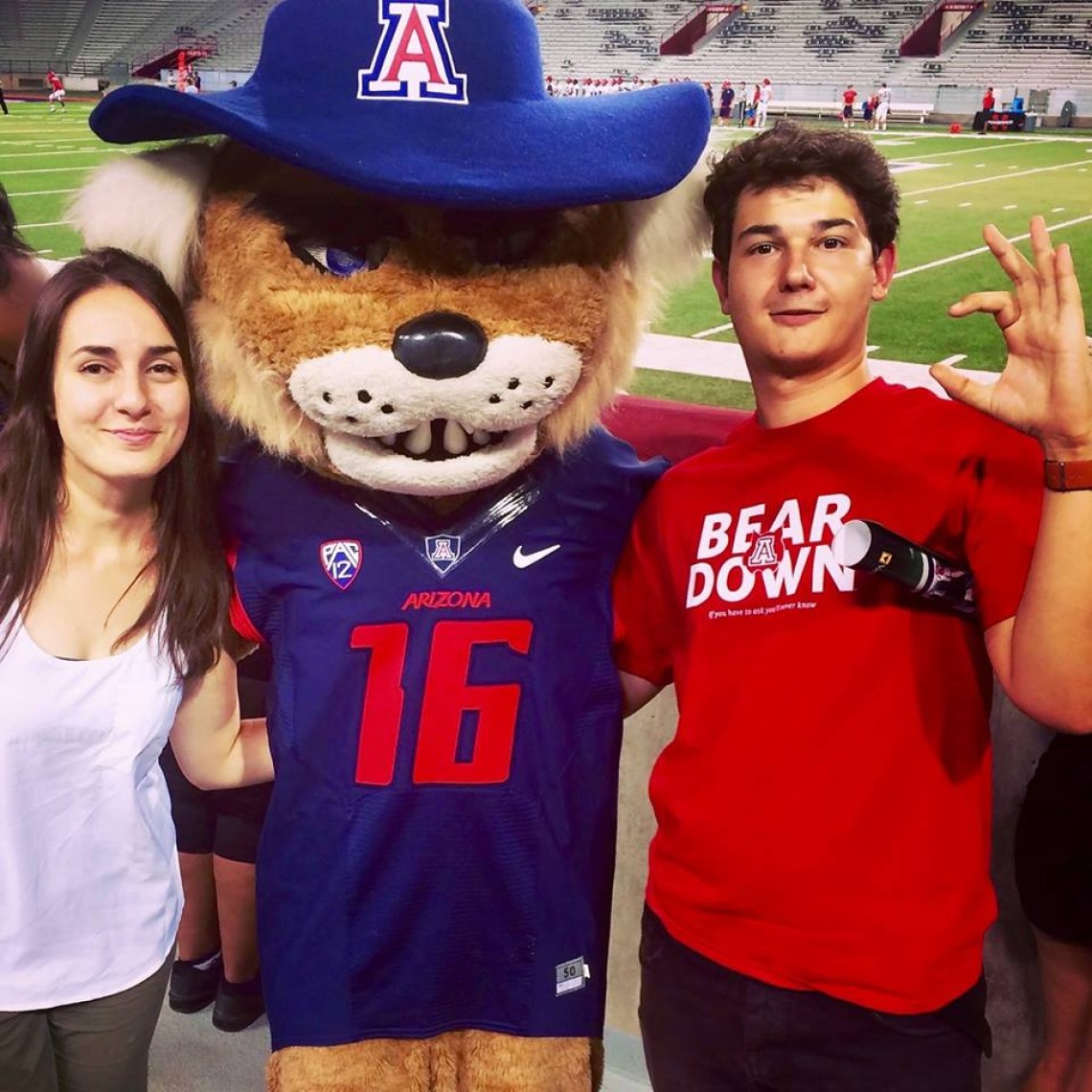 Students with Wilbur at football field